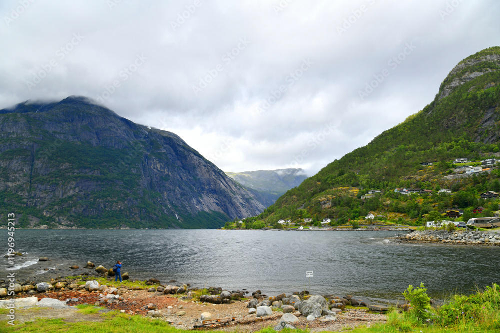 Fototapeta premium The Eidfjord is the easternmost arm of the Hardangerfjord in the Fylke Vestland in Norway. The Eidfjord is a foothill to the east of the city of Bergen.
