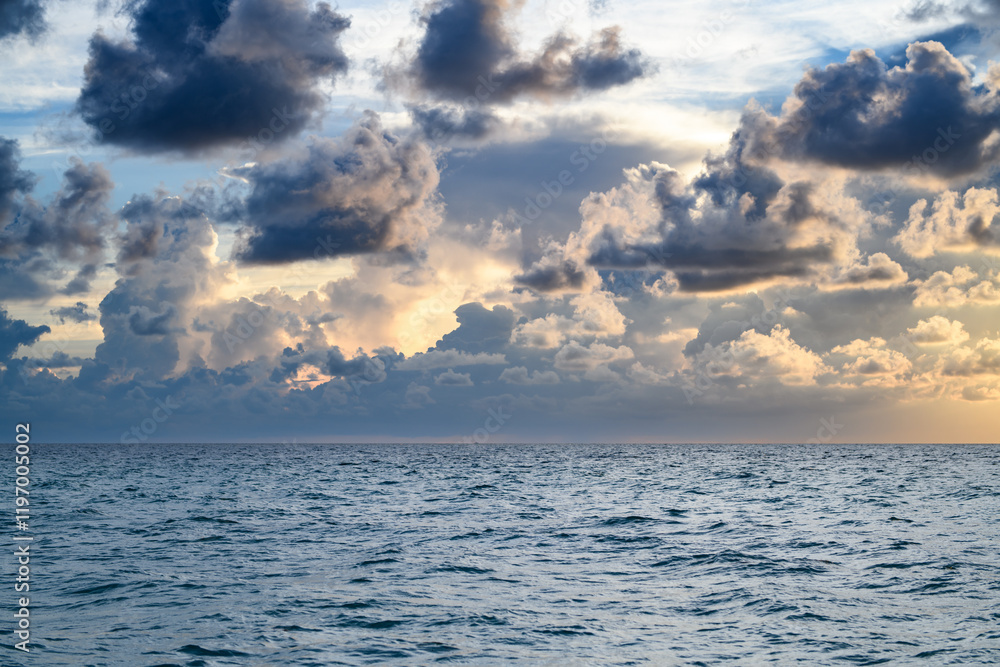 Obraz premium Sea sky background. Dark stormy dramatic cloudy sky. Sunset seascape with dramatic sky. Cloudy sky over sea.