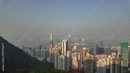 Wallpaper Mural Hong Kong - January 9, 2025: An Asian tourist takes a photo of the view of Victoria Peak Observation Deck in Hong Kong Torontodigital.ca