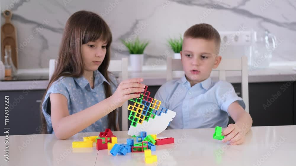 Children playing balancing board game. Family spending time together at home enjoying intellectual logic games. Children playing balancing board game. Family spending time together at home enjoying intellectual logic games.