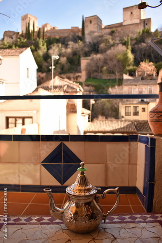 Photos Arabic teapot against the backdrop of a Moorish fortress