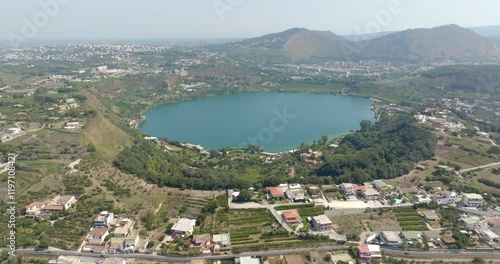 Aerial view of Lake Avernus (Lago d'Averno) located Pozzuoli, near Naples, in Campania, Italy. It is a volcanic crater lake located in Phlegraean Fields (Campi Flegrei). The lake is roughly circular. photo