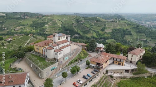 Camo, Santo Stefano Belbo, Langhe region, Cuneo, Piedmont, Italy. 4k aerial view open air museum. Langhe-Roero and Monferrato. Circling to the right around the church of San Pietro in Vincoli. photo