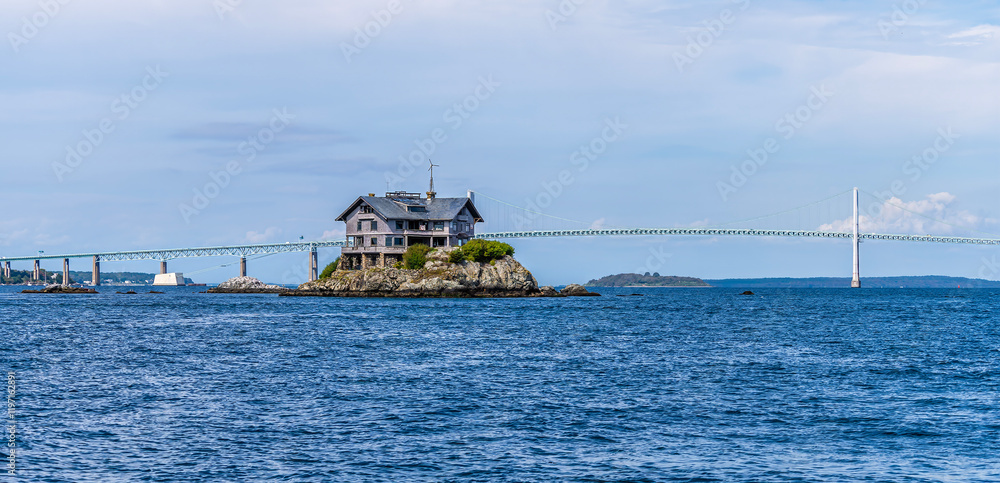 A panorama view across the Newport bridge and Clingstone island in Narragansett bay at Newport, USA in the fall A panorama view across the Newport bridge and Clingstone island in Narragansett bay at Newport, USA in the fall