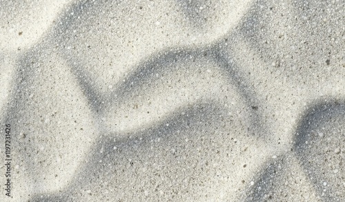 Close up of white sand surface with fine grain texture and wave like pattern