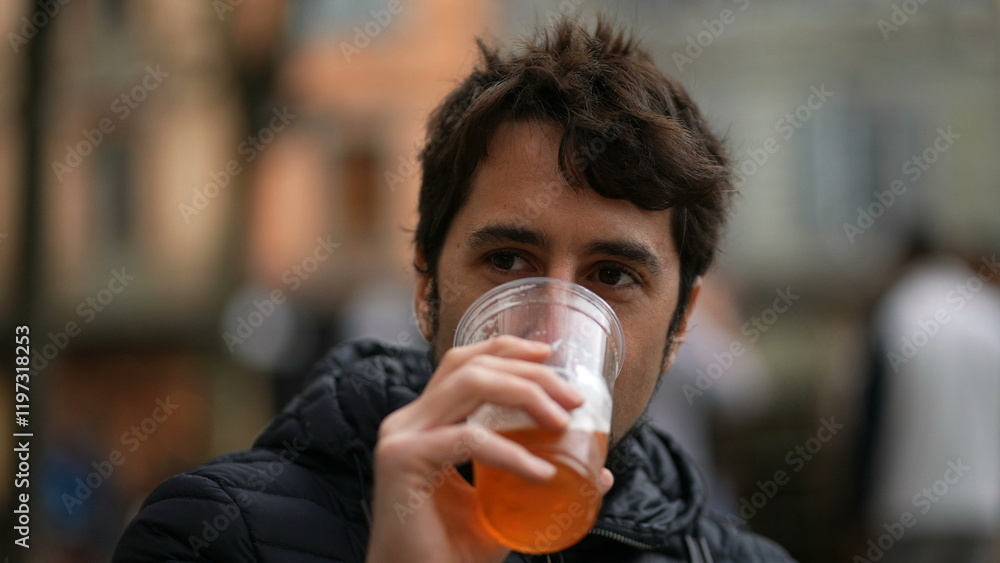 Happy casual man drinking beer outside portrait face Happy casual man drinking beer outside portrait face