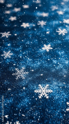 Snowflakes shimmering on a dark blue background create a magical winter atmos...