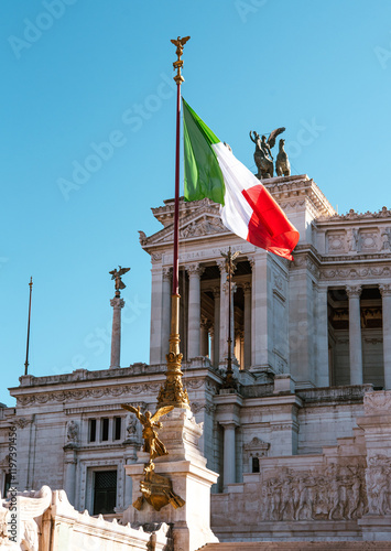 Italian flag waving in front of the Vittoriano