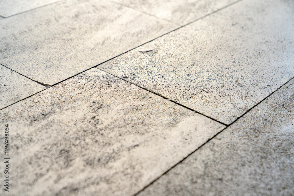 Obraz premium Close up textured concrete flooring natural light, square road tiles, urban architecture, minimalistic pattern background, grey stone, surface texture, construction material, clean geometric layout