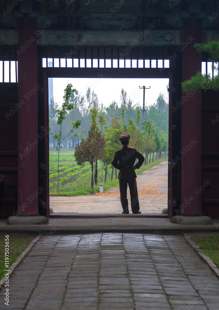 North Korean man standing at the entrance of the former royal villa of Ri Song Gye founder of the choson dynasty, South Hamgyong Province, Hamhung, North Korea North Korean man standing at the entrance of the former royal villa of Ri Song Gye founder of the choson dynasty, South Hamgyong Province, Hamhung, North Korea