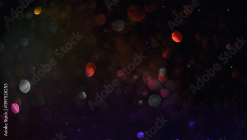 Holiday abstract bokeh on black background. Festive sparkling gold dust. Holiday concept