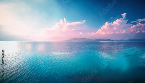 Obraz na płótnie A serene and tranquil seascape of a calm ocean meeting a clear blue sky. The water is a crystal-clear turquoise color, and the surface is gently rippled by a soft breeze. w salonie