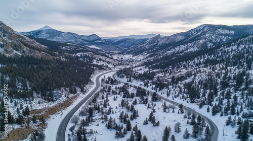Snowy Mountain Roads at Sunrise with Majestic Peaks and Scenic Winter Views