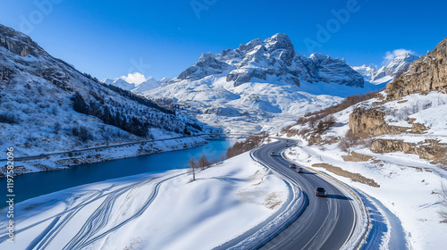 Aerial View of Snowy Mountain Roads Winding Through Majestic Winter Landscapes