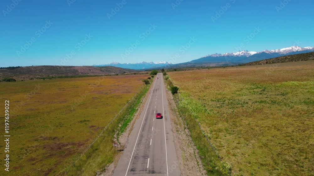 Car riding towards Andes mountains. Aerial view Car riding towards Andes mountains. Aerial view