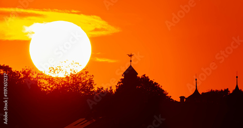 Megazoom (600mm) summer sunset with castle tower silhouettes near Moos, Deggendorf, Bavaria, Germany photo