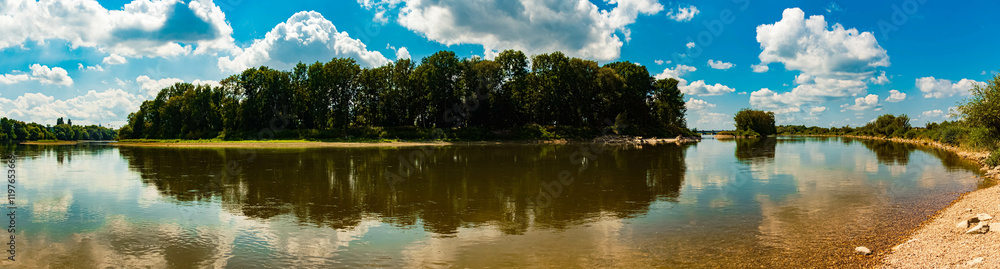 Summer view with reflections in river Danube at Straubing, Bavaria, Germany Summer view with reflections in river Danube at Straubing, Bavaria, Germany