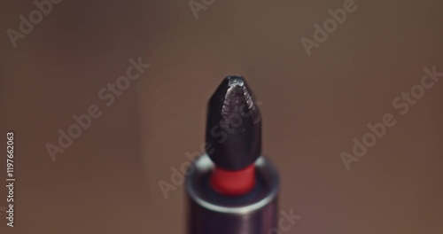 This image captures a detailed closeup shot of a screwdriver tip featuring a striking red accent PH2 photo