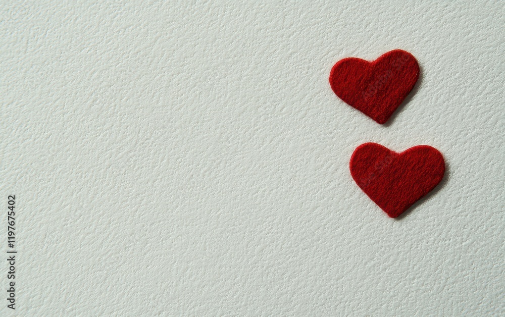 Two vibrant red hearts rest gently on a pristine white surface, symbolizing love and affection in a serene and romantic setting. Two vibrant red hearts rest gently on a pristine white surface, symbolizing love and affection in a serene and romantic setting.