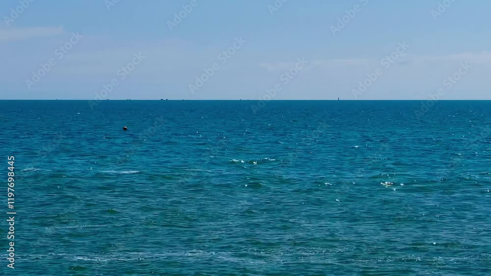 Deep blue sea meeting the clear blue sky on the horizon. A serene and endless seascape, perfect for evoking a sense of calm and freedom Deep blue sea meeting the clear blue sky on the horizon. A serene and endless seascape, perfect for evoking a sense of calm and freedom