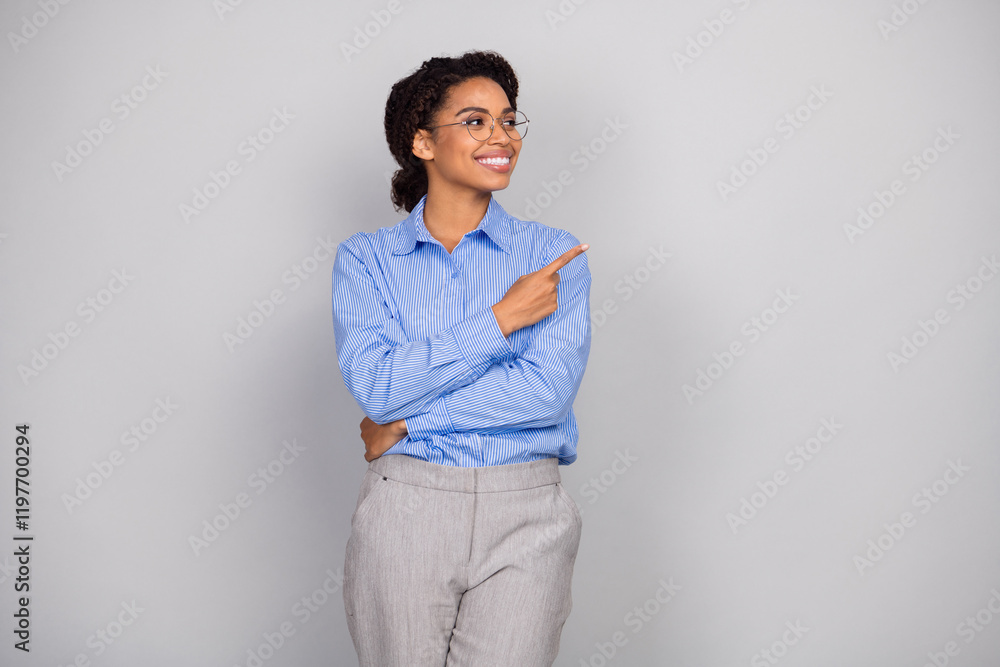 Photo portrait of lovely young business lady point look empty space dressed stylish formalwear isolated on gray color background Photo portrait of lovely young business lady point look empty space dressed stylish formalwear isolated on gray color background