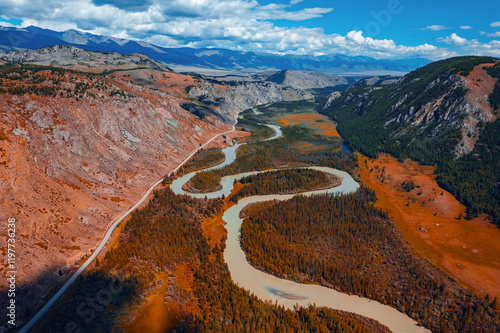 Foto Beautiful aerial landscape winding river meander in mountains with forest trees