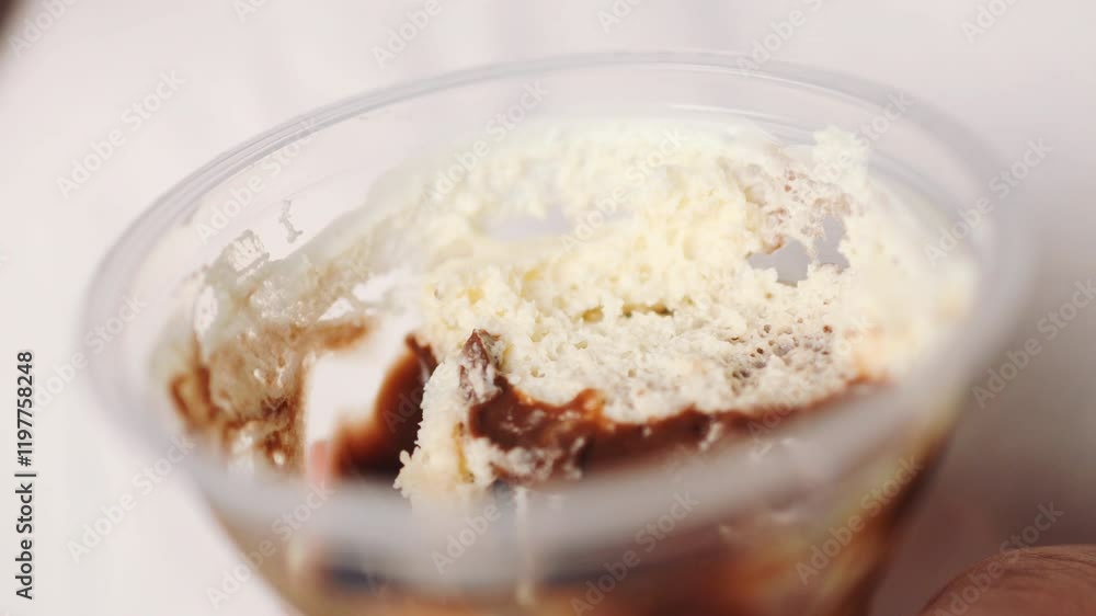 Close up of person enjoying sweet chocolate cream in jar by spoon. High quality 4k footage Close up of person enjoying sweet chocolate cream in jar by spoon. High quality 4k footage