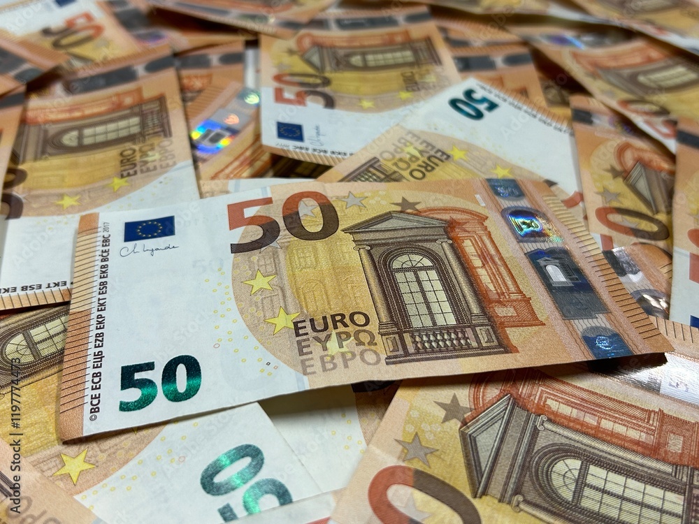 Euro banknotes background close up, fifty euro cash pile Euro banknotes background close up, fifty euro cash pile
