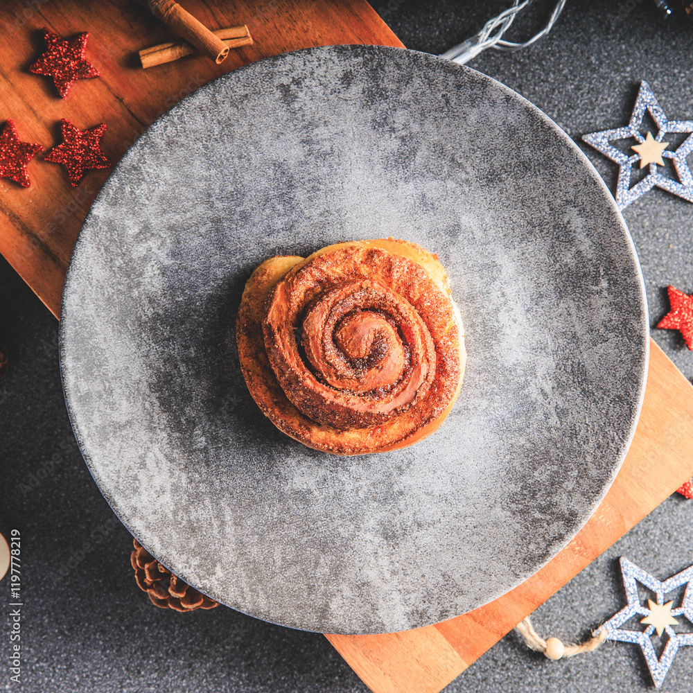 Cinnamon Rolls brioches or cinnamon rolls with icing sugar and cream cheese - decorated for Christmas
