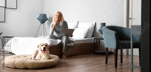 Mature woman with laptop cu...