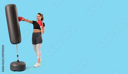 Young woman in boxing glove...