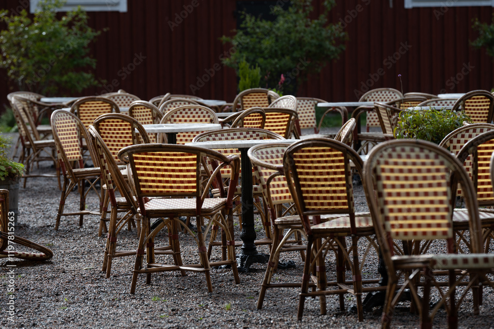 Empty chairs and tables at an outdoor cafe. Empty chairs and tables at an outdoor cafe.