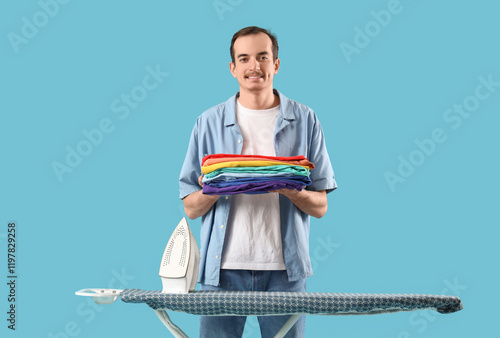 Young man with iron and fol...