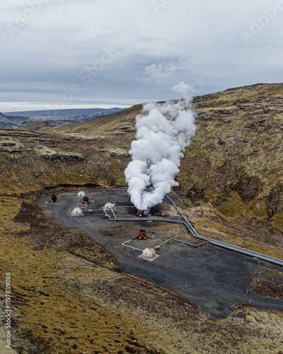 Aerial view of a geothermal power plant emitting steam on Hellisheidi, south Iceland. photo