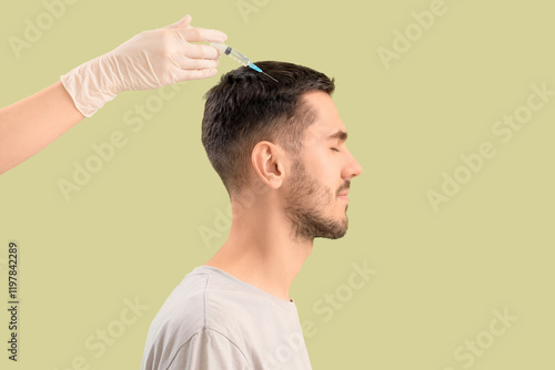 Young man receiving injecti...