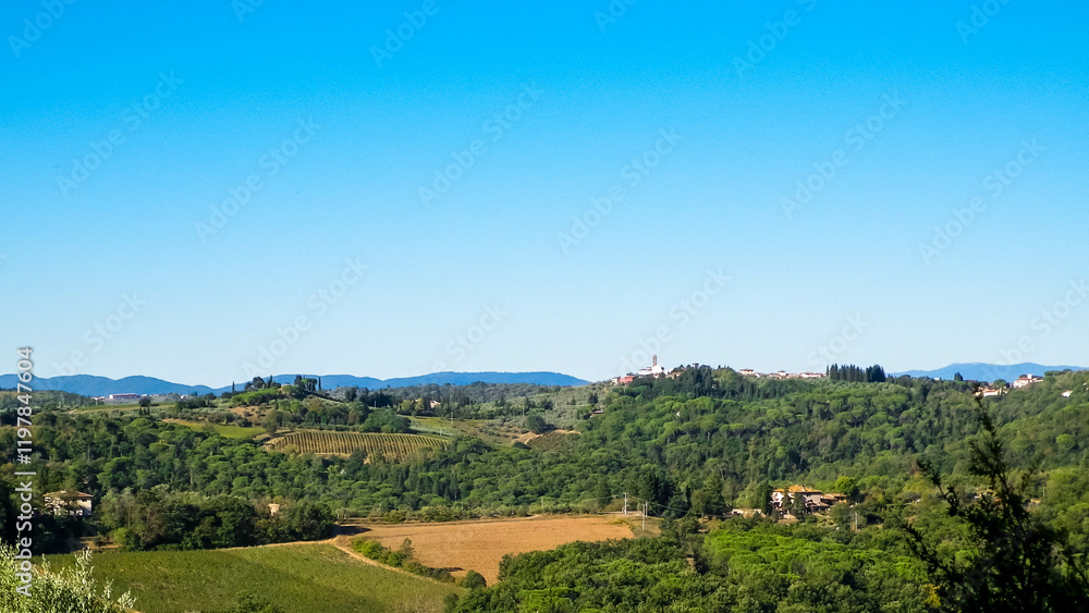 Hills, meadows and vineyards, Tuscan village, Italy Hills, meadows and vineyards, Tuscan village, Italy