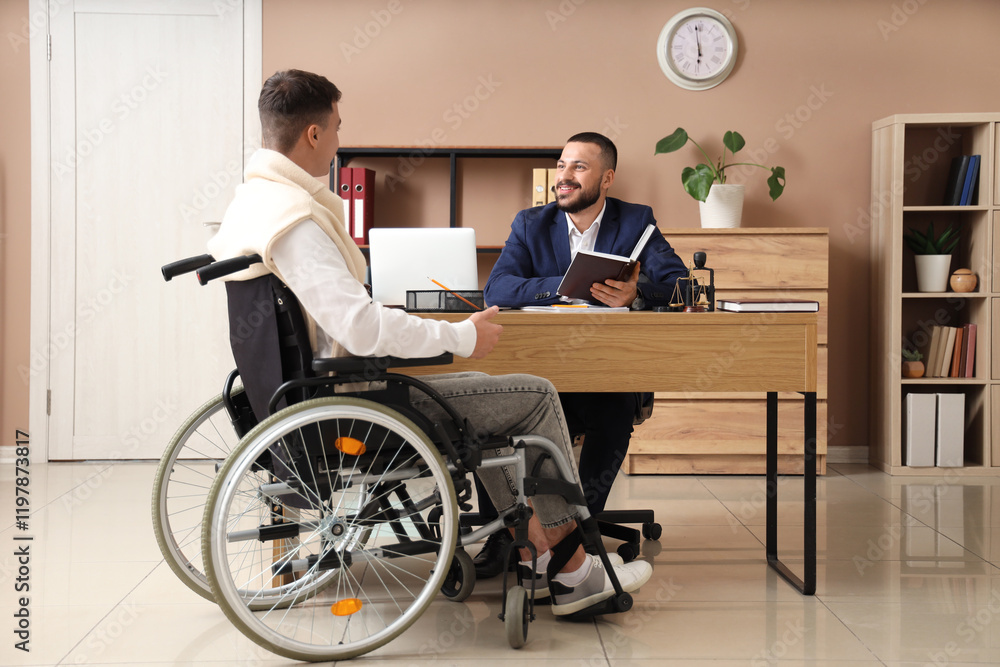 Male lawyer with book and man in wheelchair working at office Male lawyer with book and man in wheelchair working at office