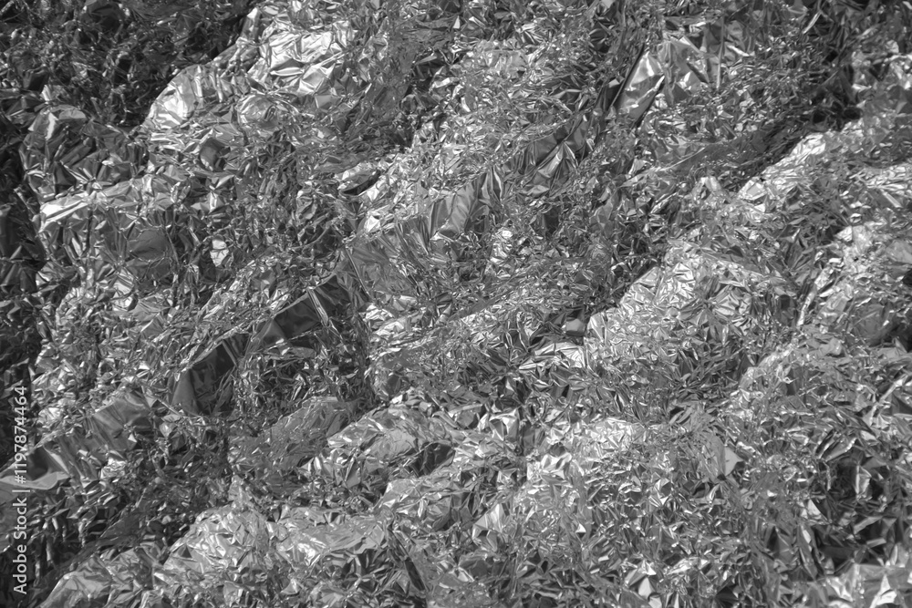 Fototapeta premium Processed collage of shiny metal silver gray foil crumpled packaging material texture