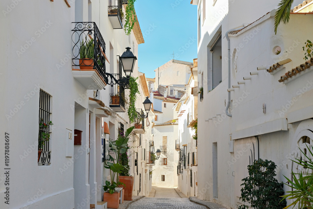 Fototapeta premium Altea’s old town features narrow streets and charming whitewashed houses, showcasing the town's traditional architecture along the Mediterranean coast in Alicante province, Valencia Community, Spain