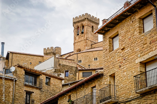 Overview of the town of Ujue in the autonomous community of Nacarra, with the fortress church of Santa Maria, a monumental complex of medieval origin photo