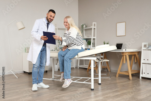 Male doctor working with ma...