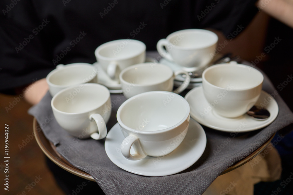 Elegant White Teacups Arranged on a Tray Perfect for a Stylish and Chic Gathering Event Elegant White Teacups Arranged on a Tray Perfect for a Stylish and Chic Gathering Event