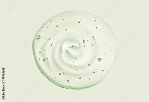 Beauty product. Green serum or gel. Cosmetic texture isolated on light green.
