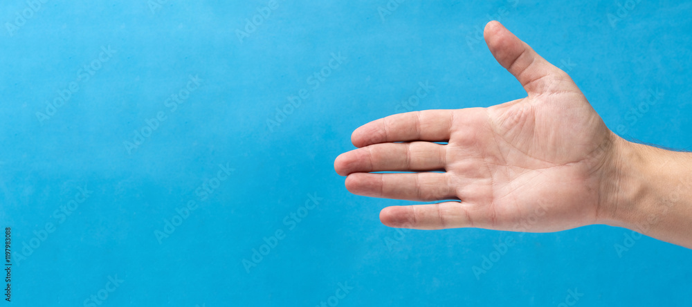 Man palm on blue background. Copy space for text. Man palm on blue background. Copy space for text.