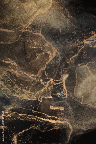 Glow gold  bronze glitter grain texture painting dot blot. Abstract lighting stain on black background.