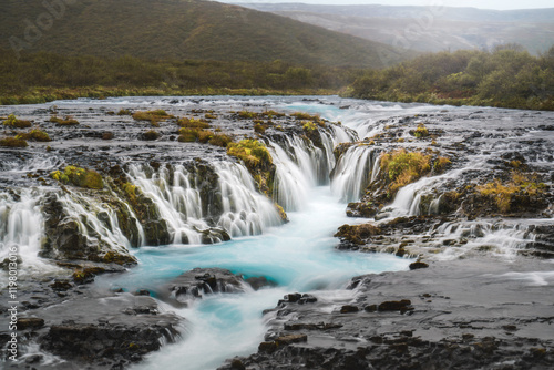 Brúarfoss waterfall, Iceland’s hidden gem, with striking turquoise waters cascading over dark volcanic rock