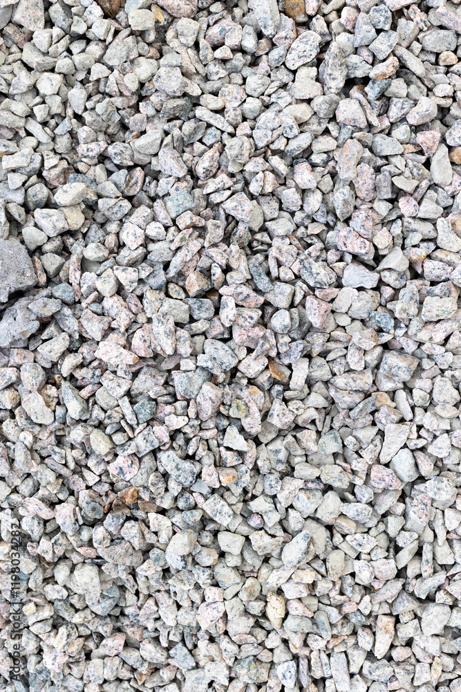 Coarse gravel texture with varied gray stones for construction and landscaping