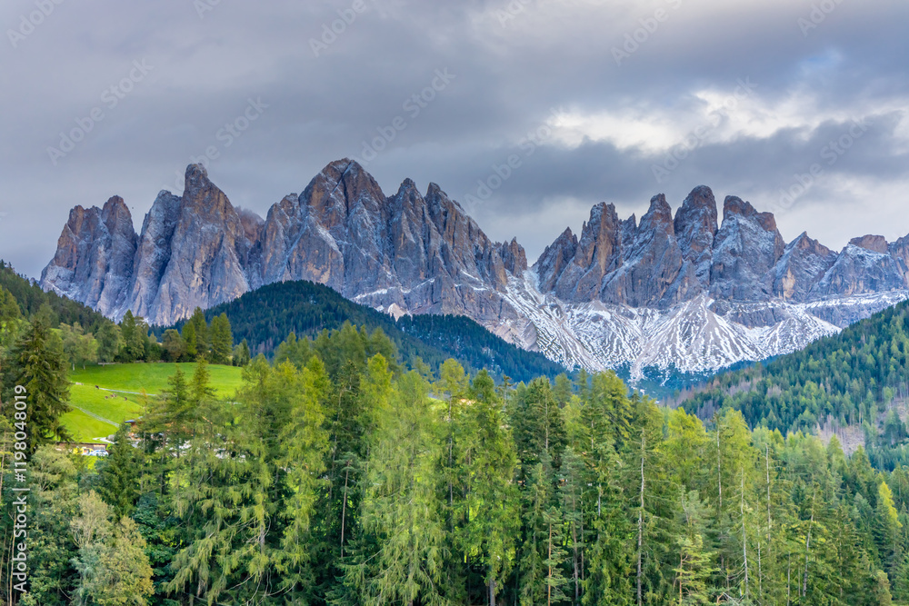 Obraz premium Panorama of Santa Maddalena village and church in the Dolomites, Puez Odle national park in Italy. Italian Dolomiti Alps scenic landscape in summer with beautiful sunlight at sunset