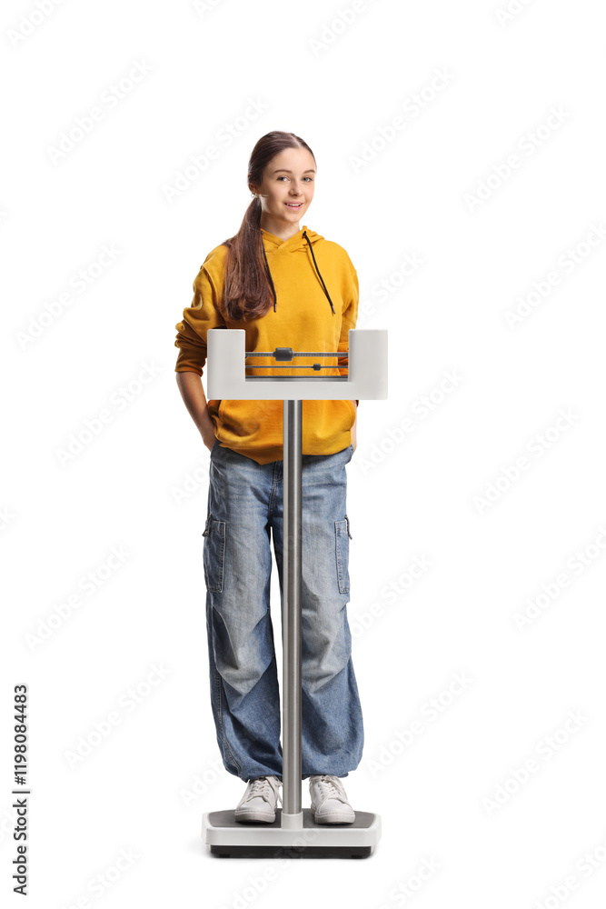 Teenage girl on a medical weight scale Teenage girl on a medical weight scale
