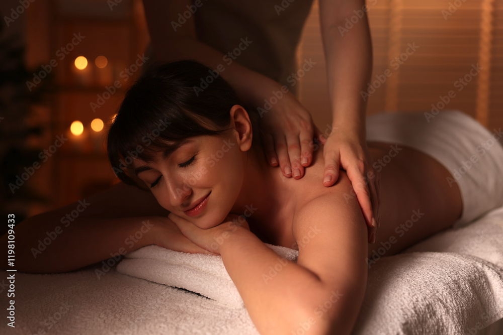 Young woman receiving massage in spa salon Young woman receiving massage in spa salon